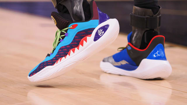 Golden State Warriors guard Stephen Curry's multicolor Under Armour sneakers.